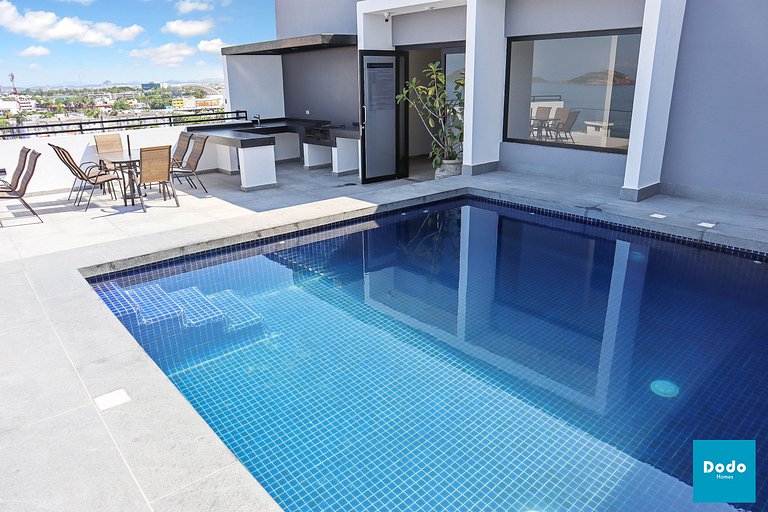 Torre con roof garden y piscina vista al mar