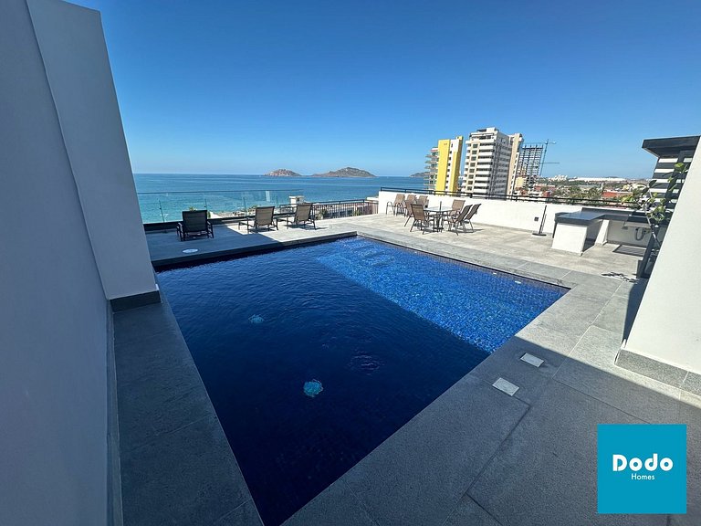 Torre con roof garden y piscina vista al mar